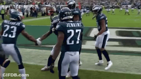 Football Players On Field With Number 27 GIF