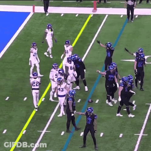Football Players On Field With Number 7 GIF