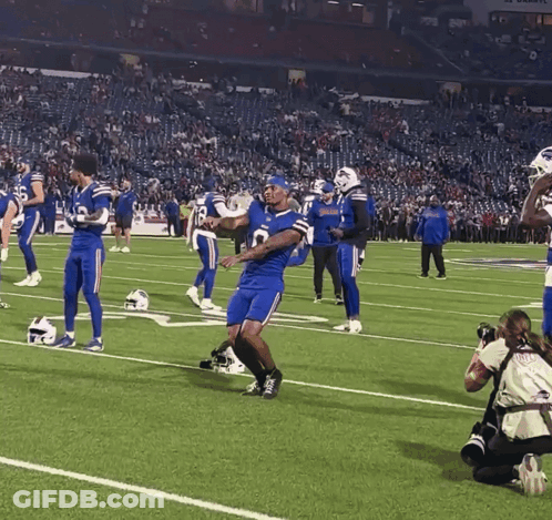 Football Players On Field With Number 8 Jersey GIF