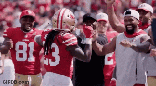 Football Players On Field With Number 83 Jersey GIF