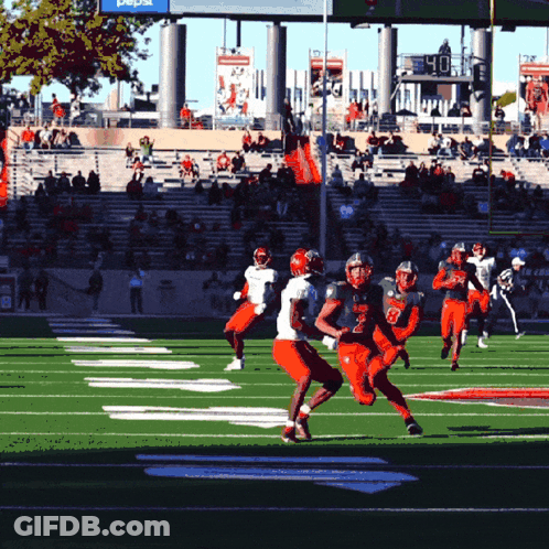 Football Players On Field With Pepsi Sign GIF