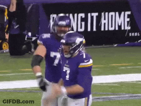 Football Players On Field With Reign It Home Sign GIF