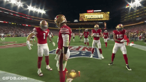 Football Players On Field With Touchdown Screen GIF