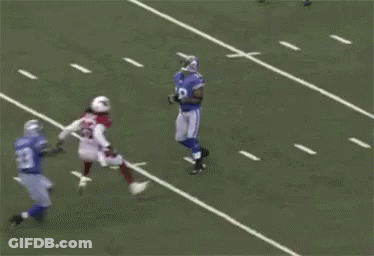 Football Players Playing Game With Referee GIF