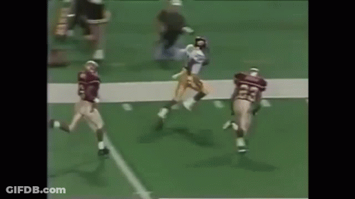 Football Players Playing On Field With Referee GIF