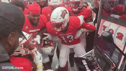 Football Players Playing Slot Machine Number 13 Jersey GIF