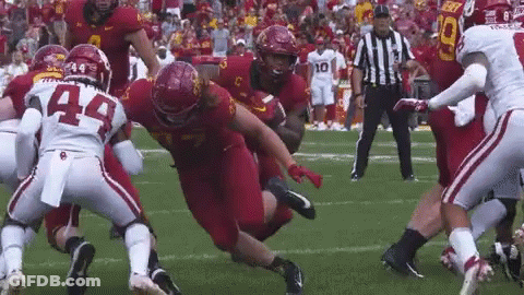 Football Players Playing With Referee GIF