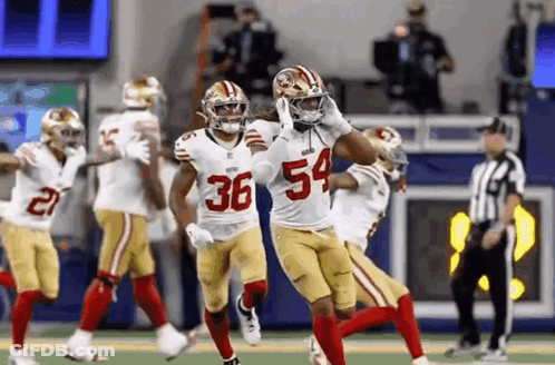 Football Players Running Number 54 GIF