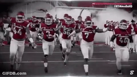 Football Players Running On Field Black And White GIF