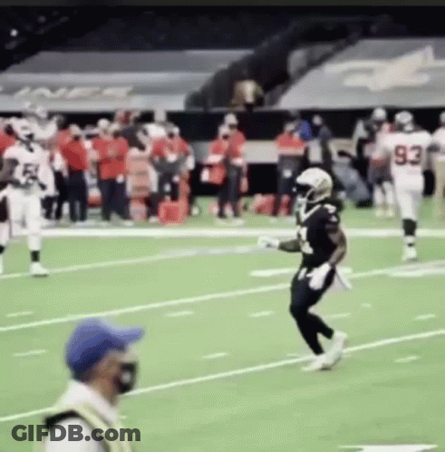 Football Players Running On Field With Referee GIF