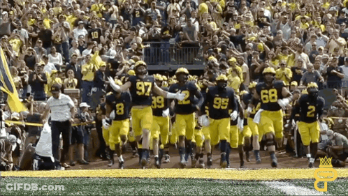 Football Players Running With Number 97 GIF