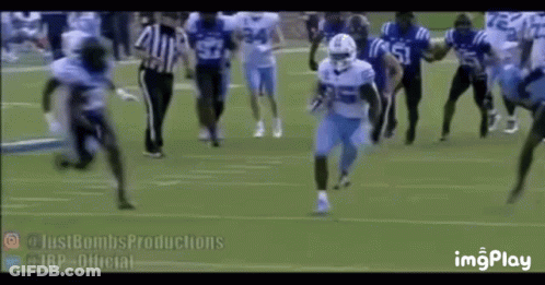 Football Players Running With Referee Watching GIF