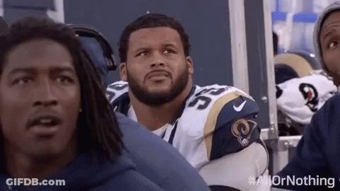 Football Players Sitting In Stadium GIF