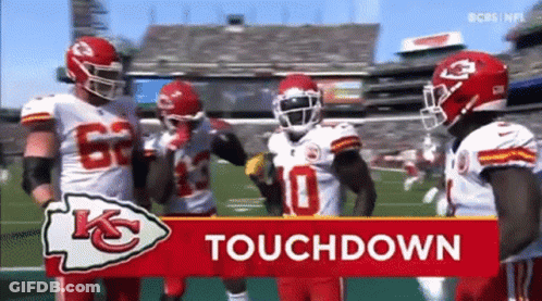 Football Players Standing In Front Of Touchdown Sign GIF