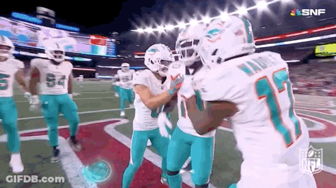 Football Players Standing On Field GIF