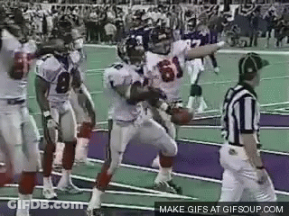 Football Players Standing On Field GIF