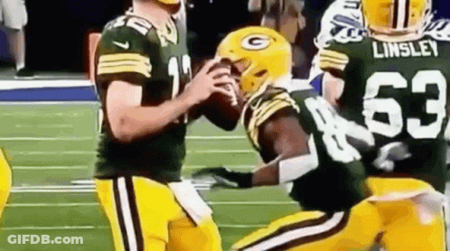 Football Players Standing On Field GIF