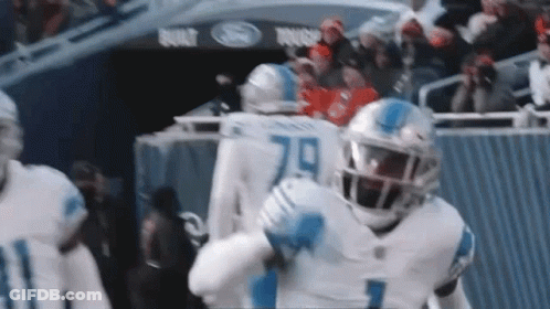 Football Players Standing On Field GIF