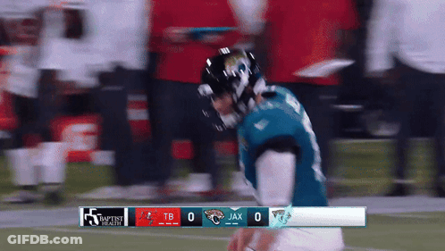 Football Players Standing On Field GIF