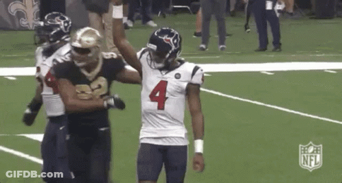 Football Players Standing On Field GIF