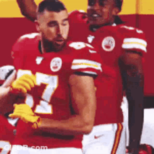 Football Players Standing On Field GIF