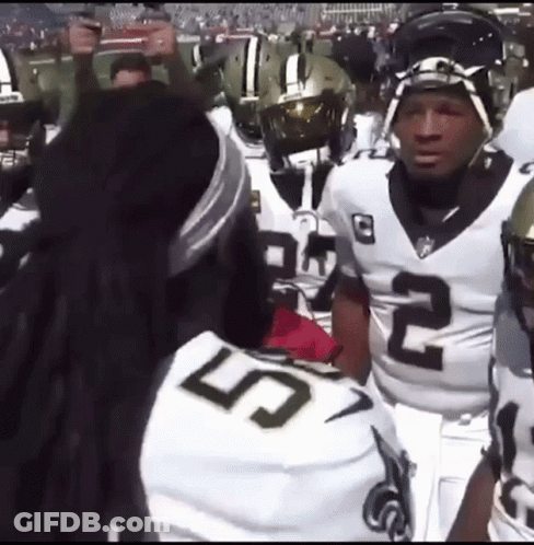 Football Players Standing On Field GIF