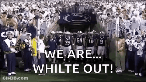 Football Players Standing On Field With Band GIF