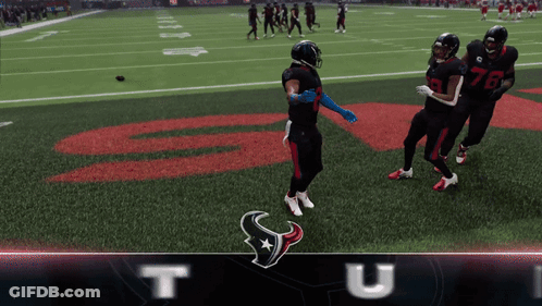 Football Players Standing On Field With Letter T GIF