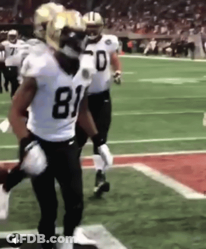 Football Players Standing On Field GIF
