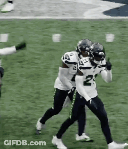 Football Players Standing On Football Field GIF