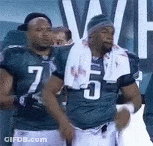 Football Players Standing Together Number 7 Jersey GIF