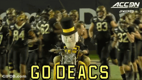 Football Players Walking On Field Saying Go Deacs GIF
