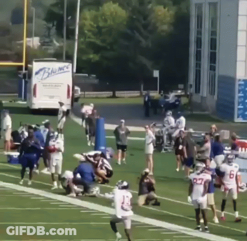 Football Players With Blue Truck Saying Blumac GIF