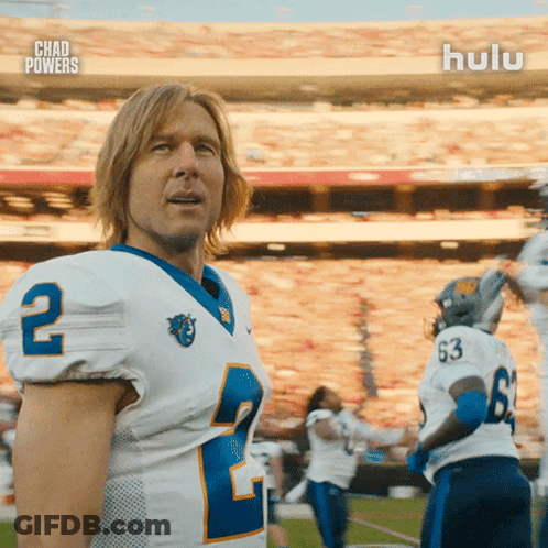 Football Players With Number 66 On Field GIF