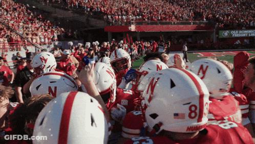Football Players With Number 8 Helmets GIF