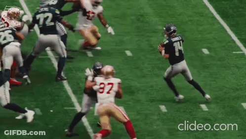 Football Thrown In Front Of To Lumen Banner GIF