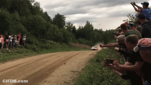 Ford Rally Car Driving Through Field GIF