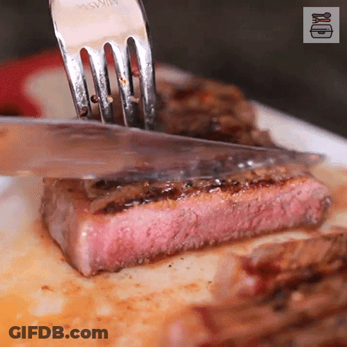 Fork Cutting Meat On White Plate GIF