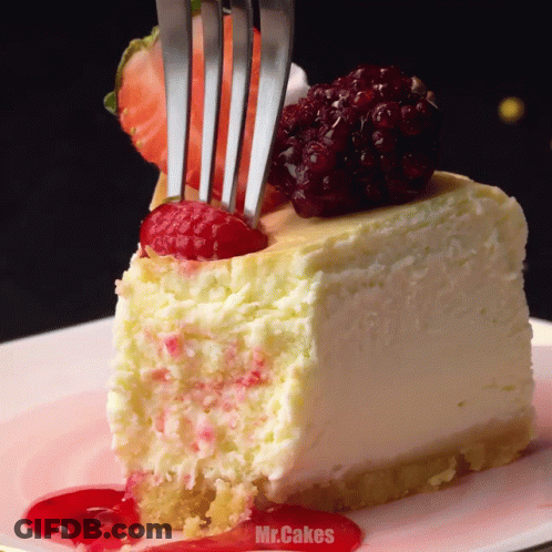 Fork Eating Cheesecake Slice With Raspberries GIF