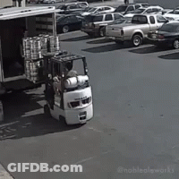 Forklift Loading Truck With Cans GIF
