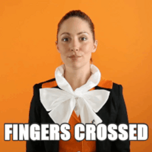 Formal Woman Fingers Crossed GIF