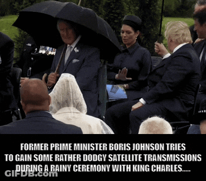 Former Prime Minister Boris Johnson Tries To Gain Some Rather Dodgy Satellite Transmissions During A Rainy Ceremony With GIF
