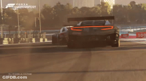Forza Motorsport Two Cars Racing On Track GIF