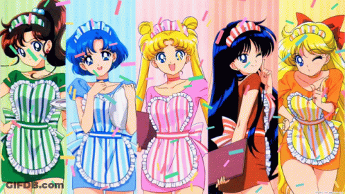 Four Anime Girls In Aprons Standing Together GIF