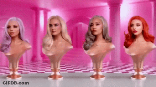 Four Busts Of Women With Different Hair Colors Are Lined Up In A Row On A Table . GIF