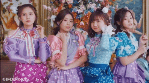 Four Girls Posing For Picture In Front Of Painting GIF