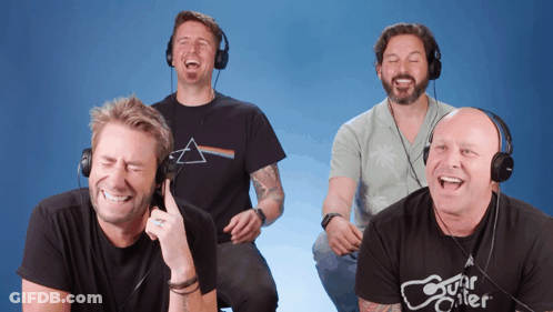 Four Men Laughing In Headphones, One Shirt Says Guitar Killer GIF