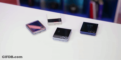 Four Phones On A Table One Of Which Has The Time Of 11:29 On It GIF
