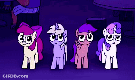 Four Ponies Standing Next To Each Other In A Dark Room GIF