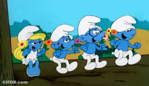Four Smurfs Are Standing Next To Each Other With Flowers In Their Hands GIF